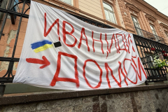 A-banner-with-the-words-we-are-not-here-is-displayed-on-a-balcony-in-the-city-of-prague