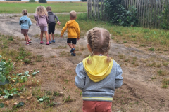 A-group-of-children-walking-through-a-field