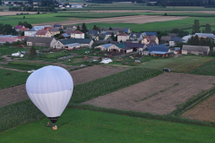 A-hot-air-balloon-flying-over-a-small-town