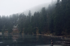 A-man-sitting-on-a-boat-in-a-lake