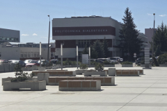 A-parking-lot-with-a-building-in-the-background