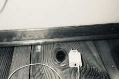 A-white-cord-disconnected-from-a-wall-outlet