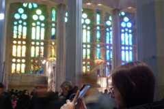 A-woman-taking-a-picture-of-a-building