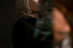 A-woman-with-blonde-hair-and-a-black-shirt