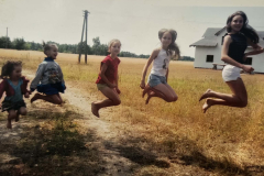 Three-girls-jumping-in-the-air