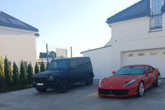 Two-cars-parked-in-front-of-a-house