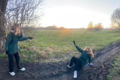 Two-girls-playing-in-the-mud-hole