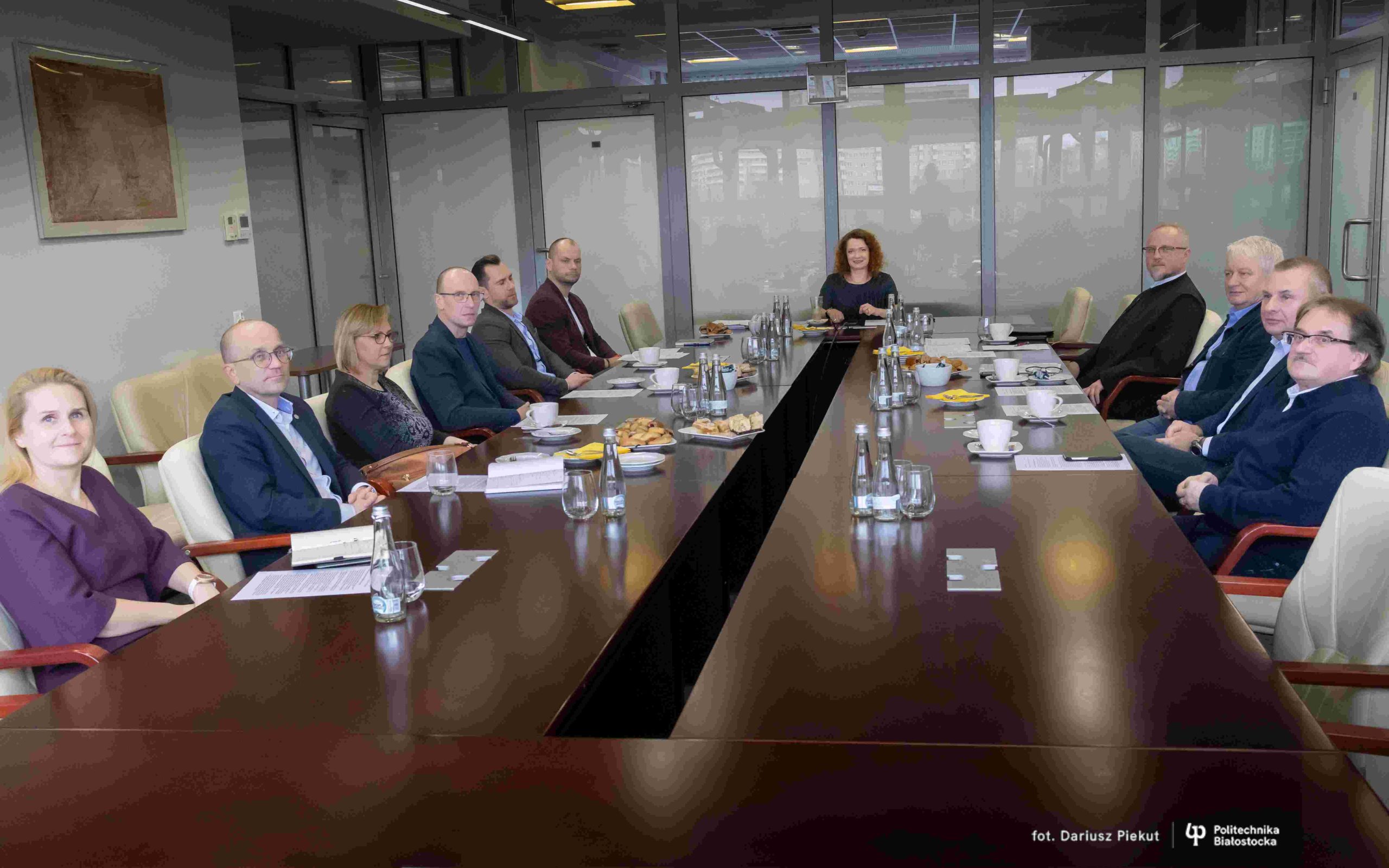 A group of people sitting by the table